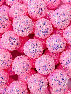 pink and blue glitter balls are piled together