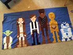 the star wars quilt is made to look like it's being displayed on the floor