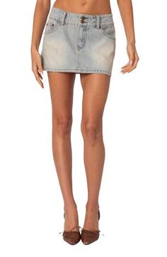 An on-trend low-rise cut defines this nonstretch-denim skirt featuring fading and distressing for a chic lived-in look. Zip fly with button closure Five-pocket style 100% cotton Machine wash, dry flat Imported Fitted Ripped Mini Bottoms, Fitted Ripped Bottoms In Mini Length, Fitted Distressed Medium Wash Mini Skirt, Ripped Fitted Denim Mini Skirt, Distressed Fitted Mini Skirt, Ripped Cutoff Mini Skirt, Ripped Fitted Cutoff Mini Skirt, Ripped High-rise Fitted Mini Skirt, Fitted Ripped Cutoff Mini Skirt