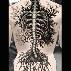 the back view of a man's torso with trees and roots on it