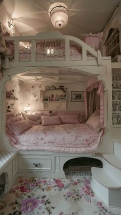 a bunk bed in the middle of a room with flowers on the floor and walls