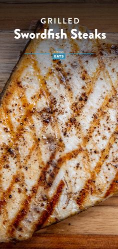 grilled swordfish steaks on a cutting board with the title grilled swordfish steaks