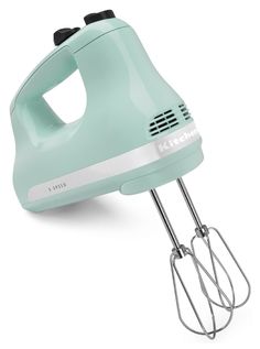 a light green kitchen aid mixer on a white background