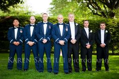 a group of men in suits standing next to each other