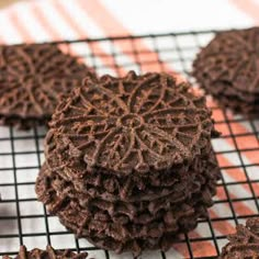 chocolate cookies are cooling on a wire rack