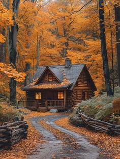 a log cabin in the woods surrounded by fall leaves