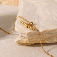 The T Bar Anklet stands out with its sleek, minimalist design in 18k gold plating. This understated piece adds a modern, elegant touch to any look, perfect for those who appreciate subtle yet impactful fashion statements. Minimalist Everyday Gold-tone Bracelet, Adjustable Minimalist Gold Bracelet, Minimalist Yellow Gold Bracelet, Minimalist Gold-tone Chain Bracelet, Minimalist Tarnish-resistant Gold Bracelet, Minimalist Gold Bracelet, Anklet Gold, Tarnished Jewelry, Gold Anklet