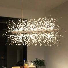 a chandelier hanging over a dining room table