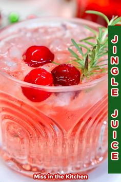 two cherries are placed on top of a drink in a glass with ice and garnish