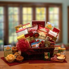 a basket filled with lots of food sitting on top of a table