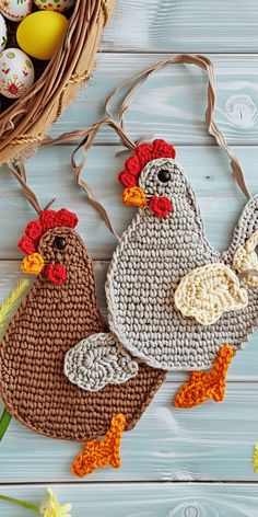 two crocheted chicken ornaments next to an easter basket