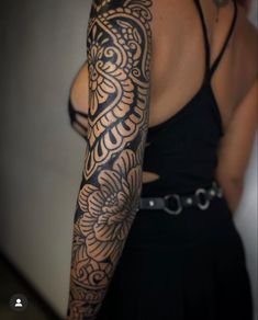 a woman with a tattoo on her arm