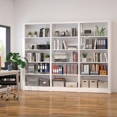 a white bookcase filled with lots of books on top of a hard wood floor