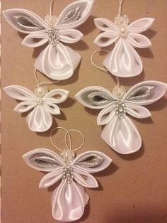 some white and silver ornaments hanging on a wall