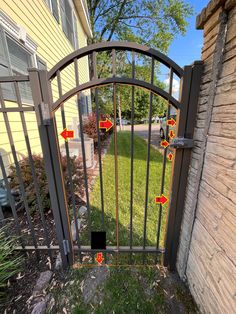 an iron gate with arrows pointing to the right