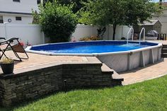 an above ground swimming pool in a backyard