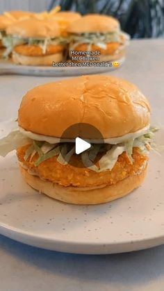 a chicken sandwich with lettuce and mayonnaise on a plate