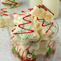 some white and green christmas cookies in a glass bowl