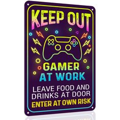 a neon sign that says keep out gamer at work leave food and drinks at door