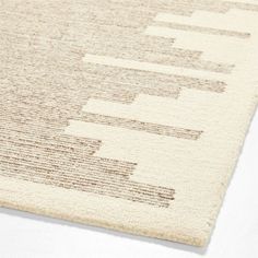 a close up of a rug on a white surface with lines drawn across the area