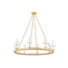 a brass chandelier with white shades