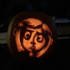 a carved pumpkin with an evil face on it