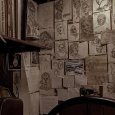 a room with many drawings on the wall