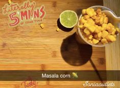 a wooden cutting board topped with cut up fruit and a bowl of mangoes next to it