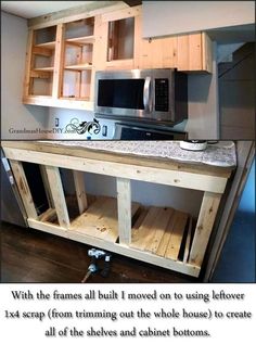 a kitchen with wooden cabinets and a microwave above the counter top that is made out of pallet wood