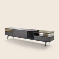 the sideboard with mirrored doors and drawers is shown in black, gold and silver