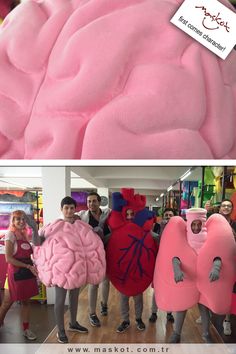 people are standing around in costumes made to look like the human body and brain,