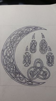 a drawing of a crescent with celtic designs on it