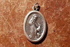 This listing is for 10 medals. Beloved by even those who do not usually venerate the saints, St Francis of Assisi was not only known for his devotion to God, but also for his kindness to animals and his peacefulness for all creatures, including humans. This traditional medal measures 1 inch high by 1/2 inch wide. It was made in Italy and is made of modern pewter (no lead). On the front, an image of the venerable Saint Francis and a wolf is portrayed in 3D. It measures On the back, the ... Kindness To Animals, Saint Francis Of Assisi, St Francis Of Assisi, Belief In God, Sign Of The Cross, Saint Francis, Wild Wolf, The Saints, Francis Of Assisi