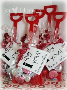 valentine's day candy in a bag with scissors and tags on the handles for sale