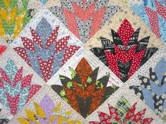 a quilt with many different designs on it