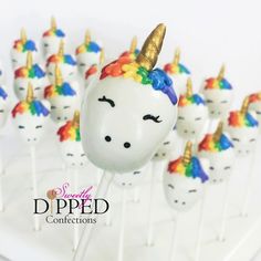 the cake pops are decorated with unicorn heads