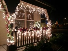 christmas lights decorate the outside of a house