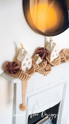 a white fireplace with some decorations on it