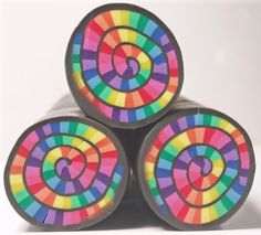 four colorful circles are stacked on top of each other