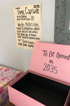 a pink box that says to be opened in 2055