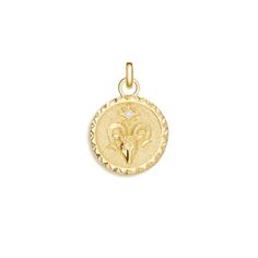 Aries Zodiac Diamond Charm - 14K Yellow Gold. A ram embossed on a disc adorned with a starlike diamond empowers this charm and its wearer with the characteristics of the Zodiac fire sign Aries: dynamism, enthusiasm, loyalty. An impression in the symbolic shape of the Aries sign engraves the textured second side, adding versatility to this striking design. 
 
 Our images feature the Lola Paperclip Chain series for styling inspiration. Please add the chain necklace or bracelet of your choice to yo Aries Sign, Jewelry Accessories Ideas, Styling Inspiration, Aries Zodiac, Diamond Charm, Eternity Ring, Quality Jewelry, Diamond Earrings, Gold Jewelry