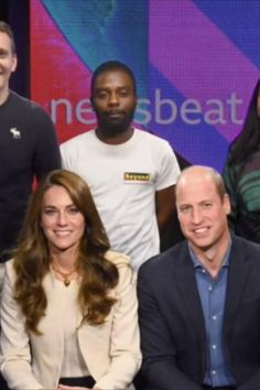 the duke and prince of cambridge are posing for a photo with some people in front of them