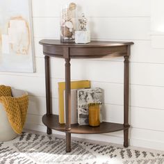 a corner table with books on it in a room