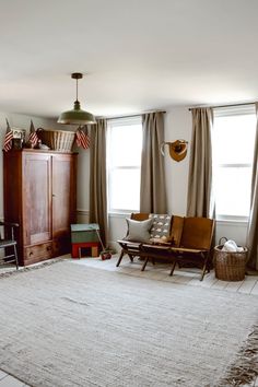 the living room is clean and ready to be used as a den or office space