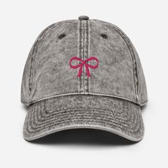 IF YOU ARE ORDERING TODAY, IT IS NOT GUARANTEED TO MAKE IT BY CHRISTMAS. THE HOLIDAY ORDER DEADLINE WAS DECEMBER 8TH. Elevate your everyday look with our Coquette Bow Embroidered Baseball Hat! This hat makes a great tie the knot bridal shower favor or bachelorette party hat. Crafted with style and sophistication in mind, this hat features a beautifully embroidered coquette bow design on the front, adding a touch of elegance to your casual attire. Made from high-quality materials, this hat offers Casual Short Brim Baseball Cap, Adjustable Short Brim Baseball Cap As Gift, Adjustable Short Brim Baseball Cap For Gift, Pink Cotton Hat Gift, Casual Bucket Hat For Gifts, Casual Bucket Hat As A Gift, Adjustable Cotton Baseball Cap For Gift, Casual Bucket Hat As Gift, Adjustable Cotton Baseball Cap As Gift