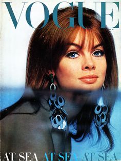 a magazine cover with a woman wearing earrings on it's face and the words, vogne at sea