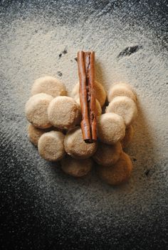 a bunch of food that is laying on the ground with some cinnamon sticks sticking out of it