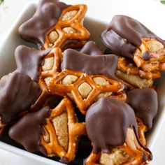 chocolate covered pretzels in a white bowl