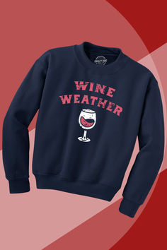 a sweatshirt with the words wine weather on it and a glass of wine in front