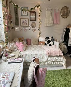 a bedroom decorated in pink and white with teddy bears